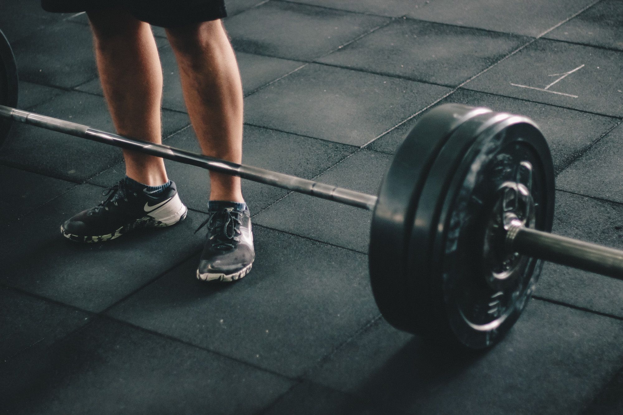 A barbell prepared for strength training in a gym